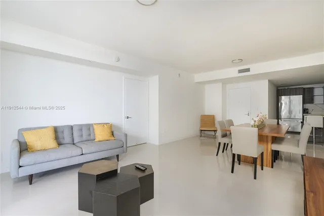 a living room with furniture and a couch