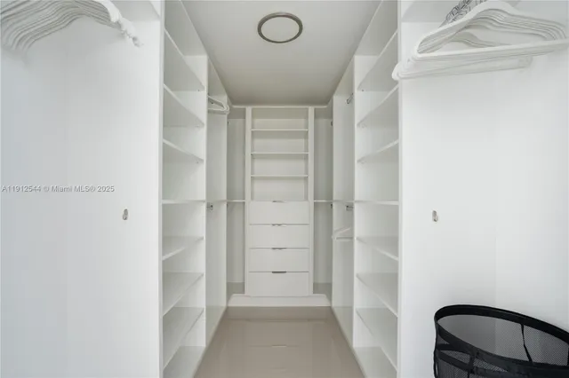 a view of an empty walk in closet