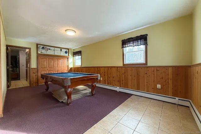 a living room with a couch and a window