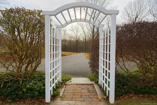 a view of a two chairs and table on the deck