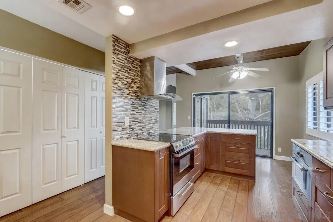 6395 Rancho Mission Road, Unit 15 San Diego, CA 92108 - Photo 13 of 21 a view of cabinets and wooden floor