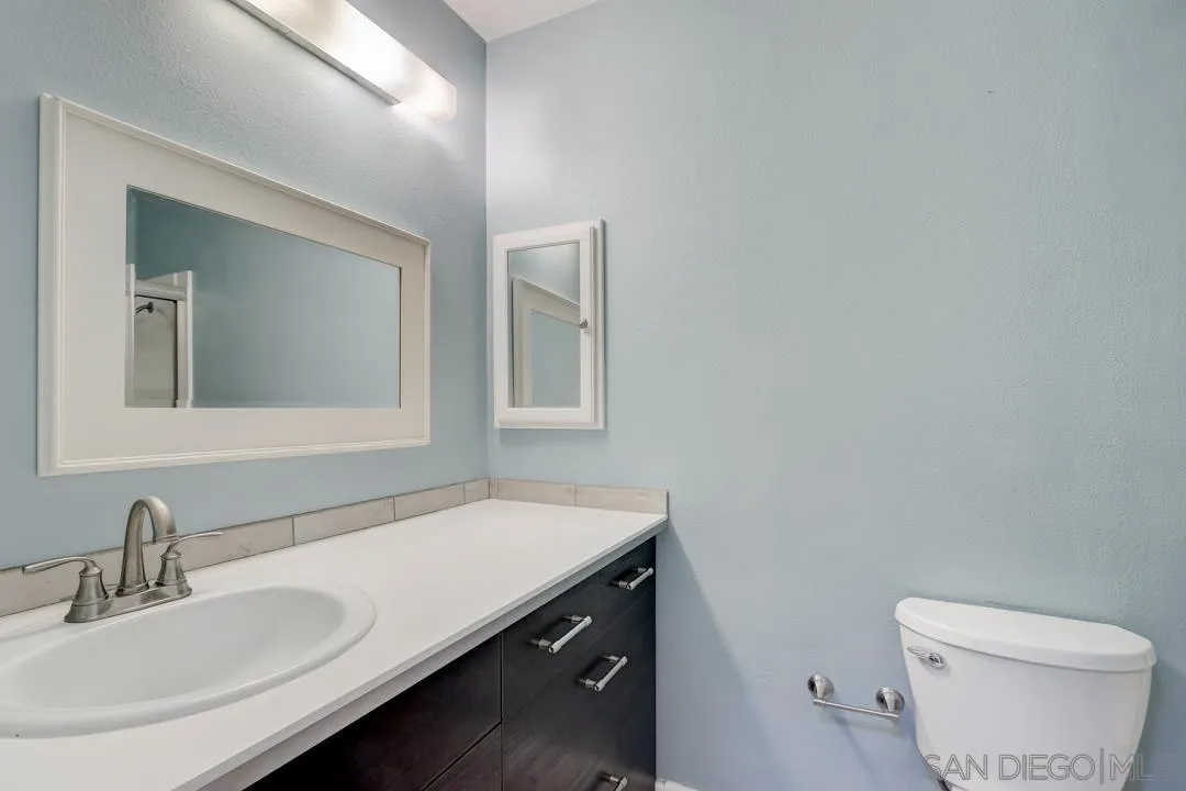 6395 Rancho Mission Road, Unit 15 San Diego, CA 92108 - Photo 19 of 21 a bathroom with a sink and a toilet