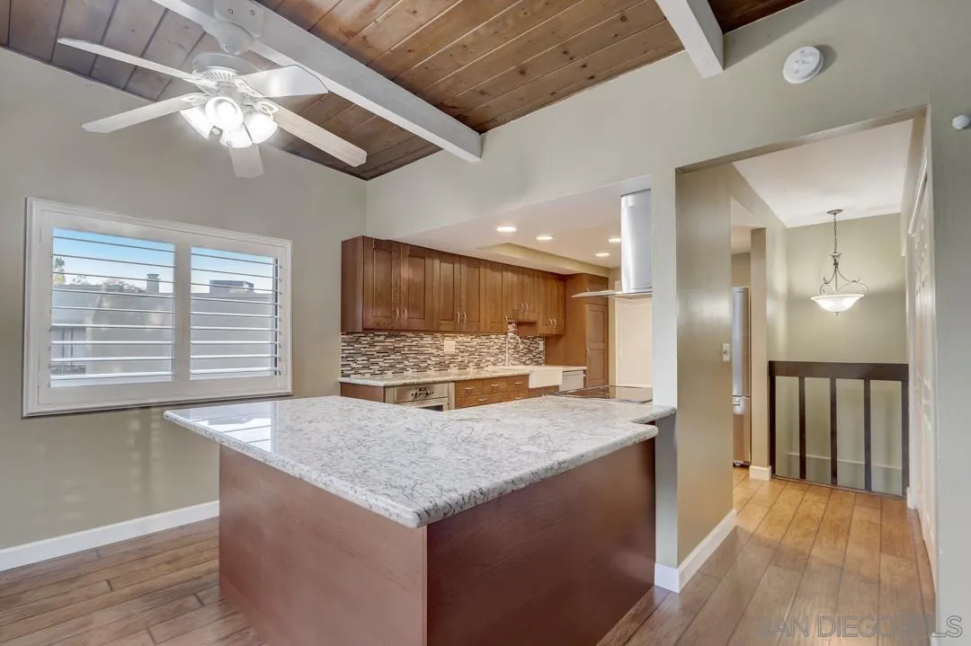 6395 Rancho Mission Road, Unit 15 San Diego, CA 92108 - Photo 10 of 21 a kitchen with a stove a refrigerator and a sink