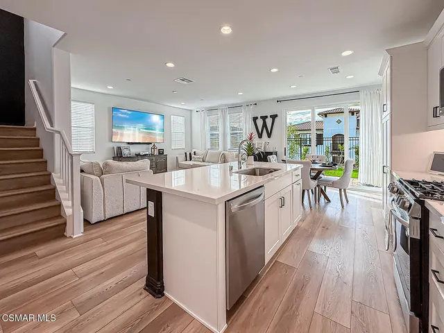 a front view of a house with a yard glass top table and chairs