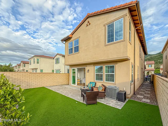 a bathroom with a shower curtain and a sink