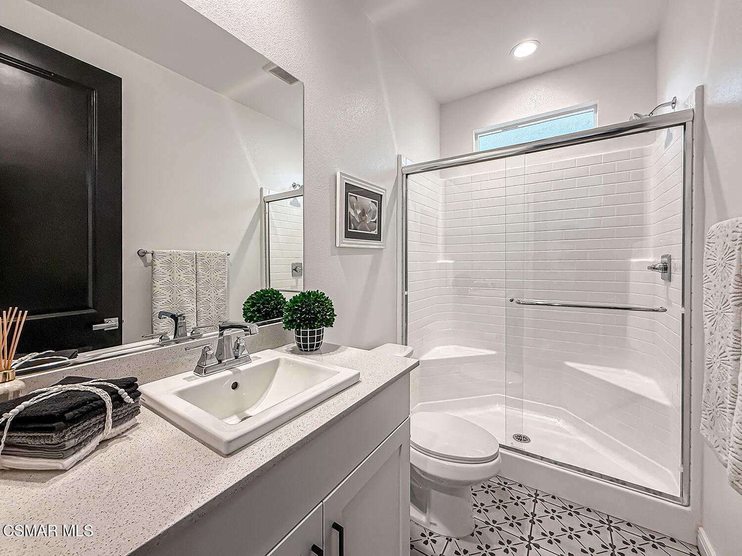 335 Fraser Point Camarillo, CA 93012 - Photo 31 of 85 a bathroom with a sink toilet a mirror and shower