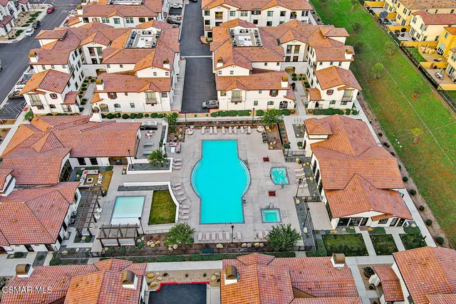 a hallway with stairs and furniture