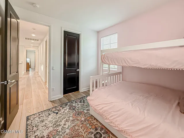 a view of a room with gym equipment and a large window