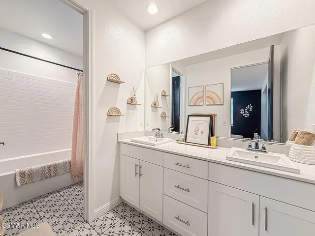 a view of a livingroom with furniture and a large window