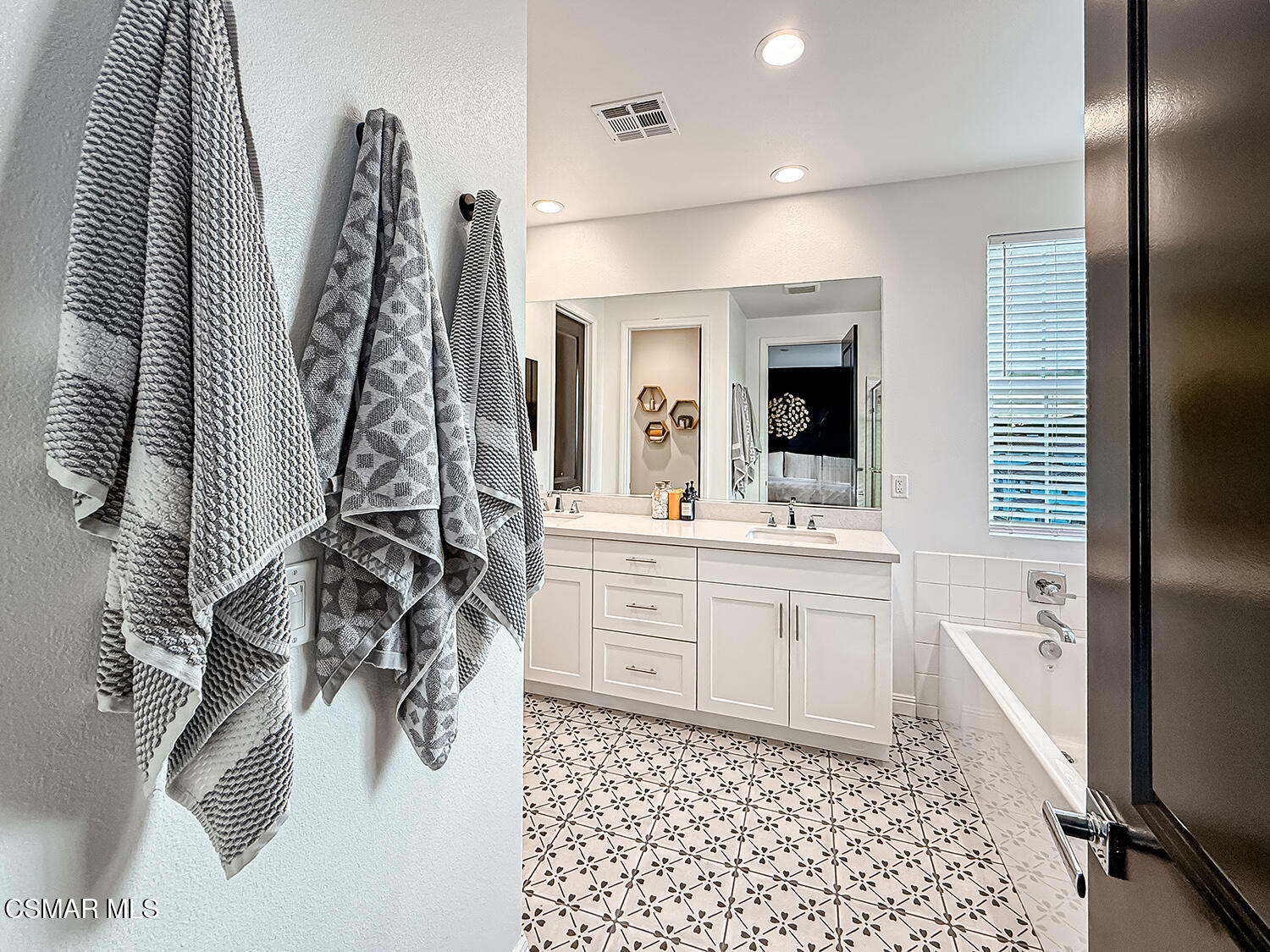 335 Fraser Point Camarillo, CA 93012 - Photo 58 of 85 a bathroom with a sink a mirror and a shower