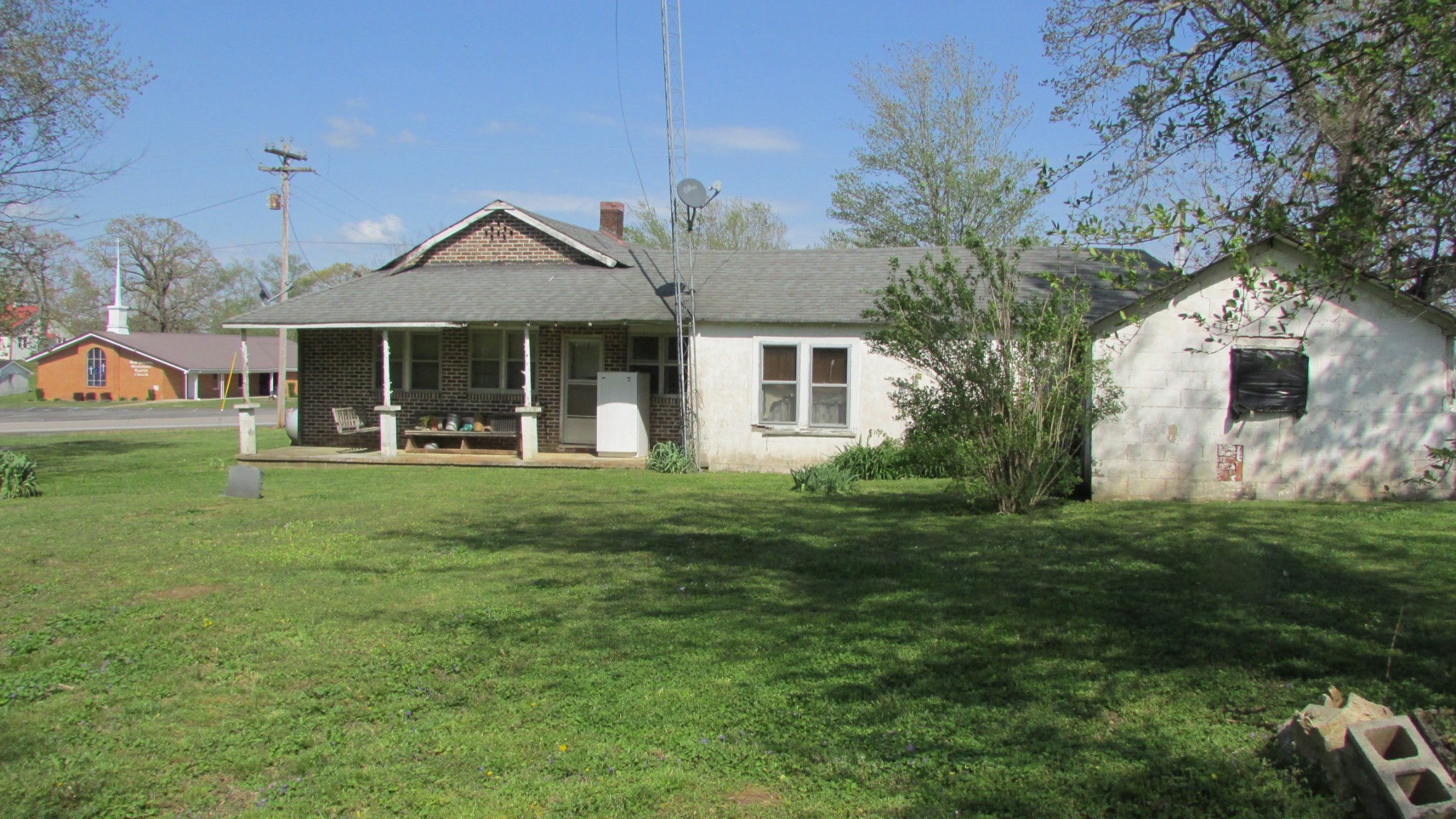1133 Rabbit Trail Road Five Points, TN 38457 - Photo 9 of 11 a front view of a house with a garden and porch