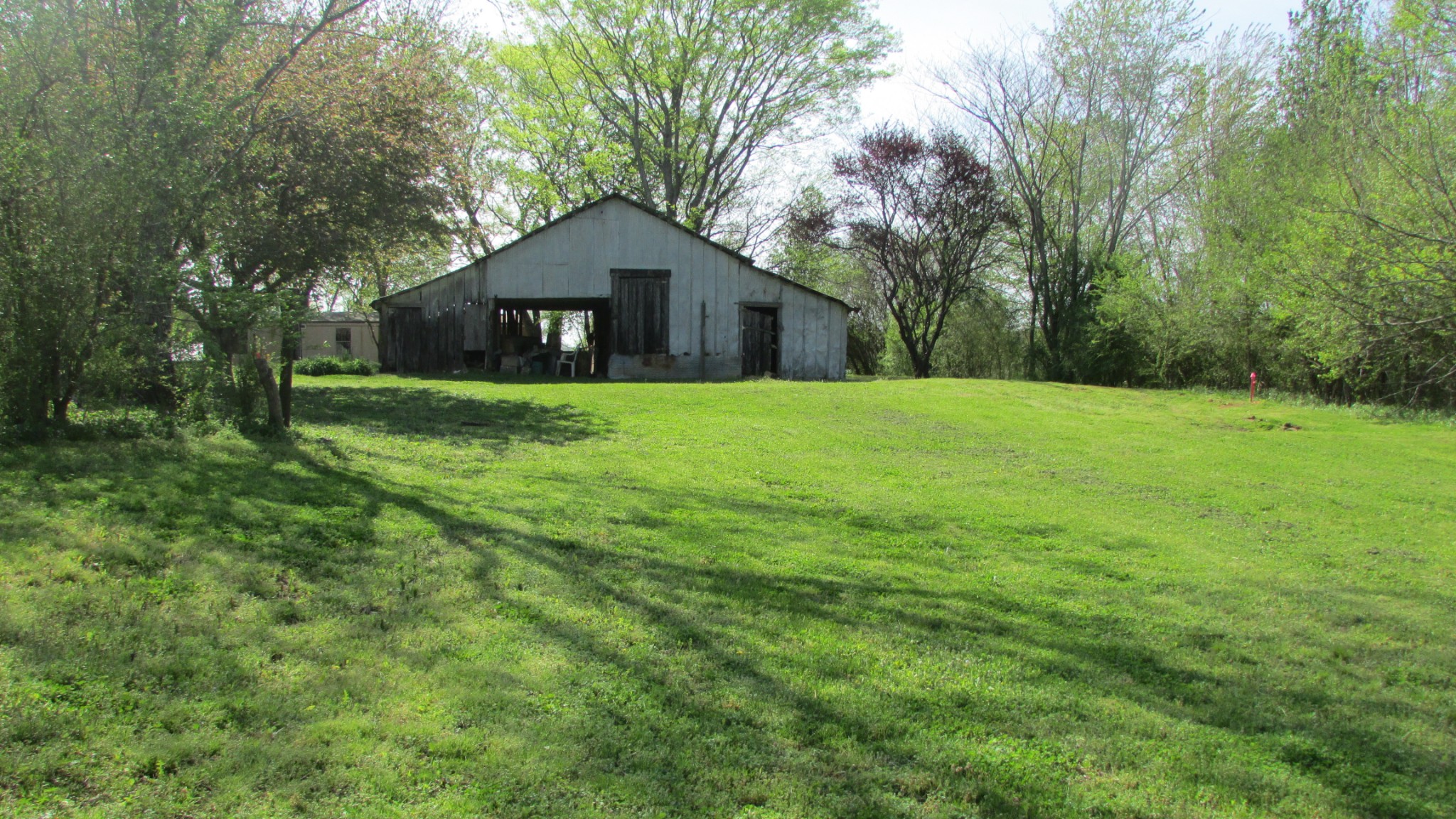 1133 Rabbit Trail Road Five Points, TN 38457 - Photo 10 of 11 a house with huge green field in front of it
