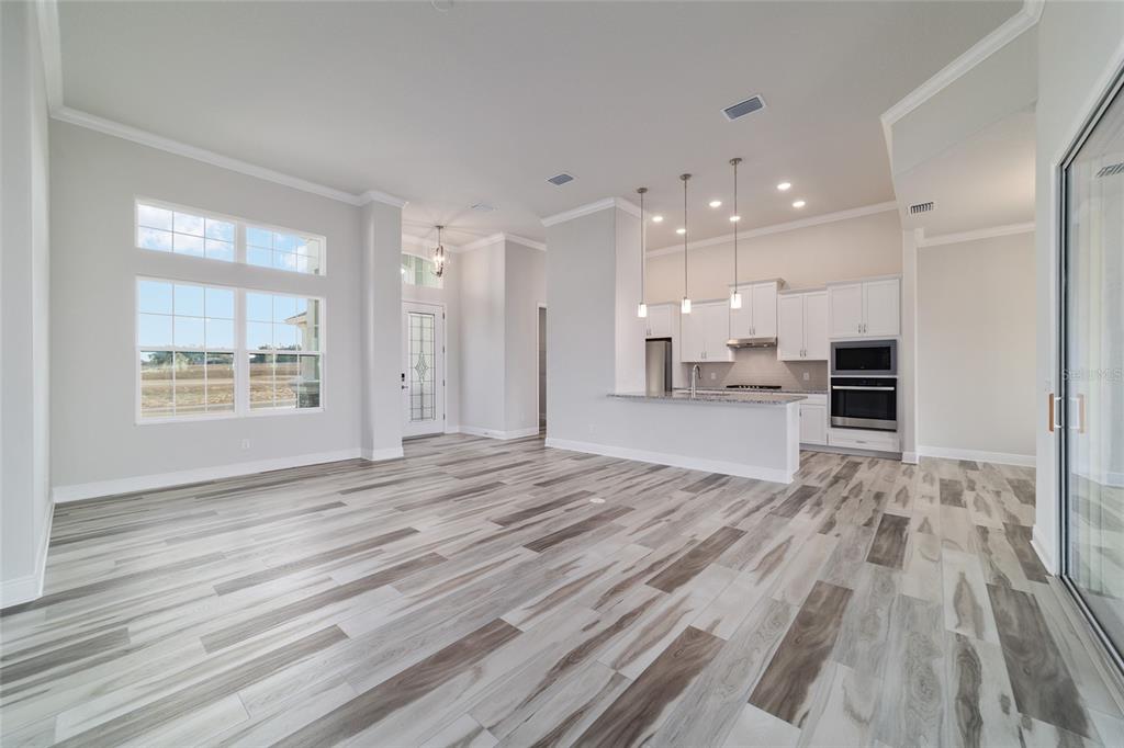 1499 East Pegasus Lane Inverness, FL 34453 - Photo 22 of 46 a view of empty room with kitchen and window