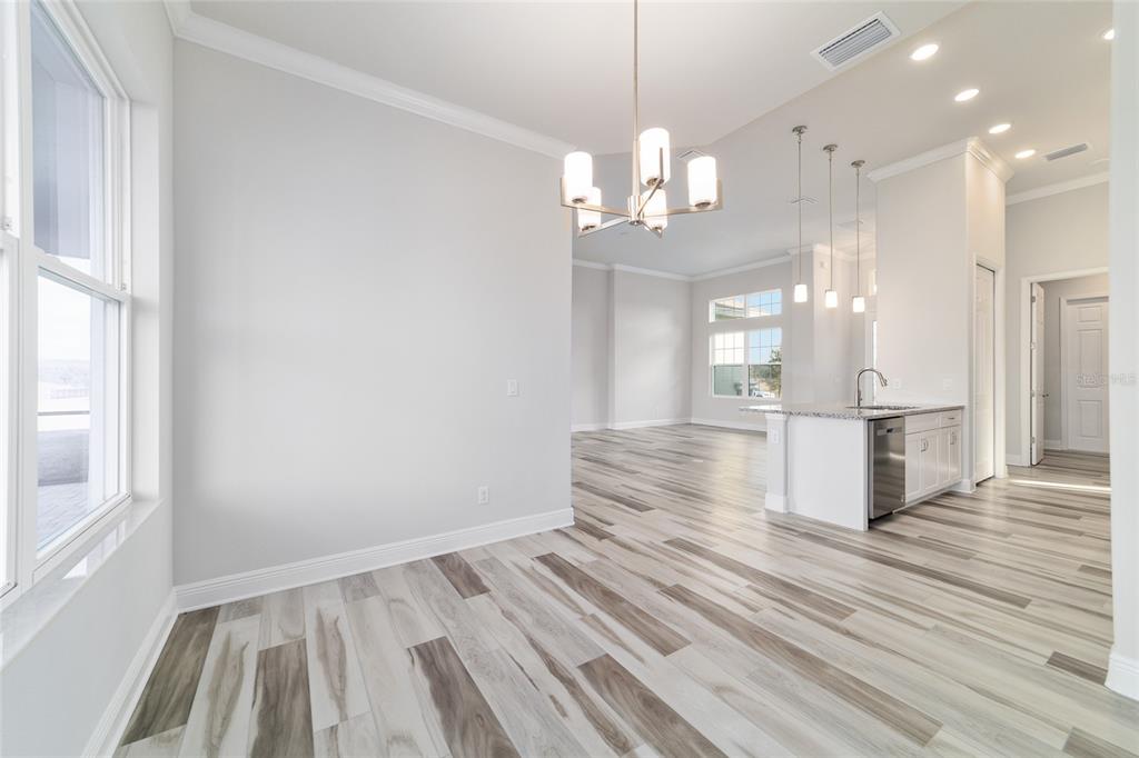 1499 East Pegasus Lane Inverness, FL 34453 - Photo 24 of 46 a view of a room with wooden floor and windows