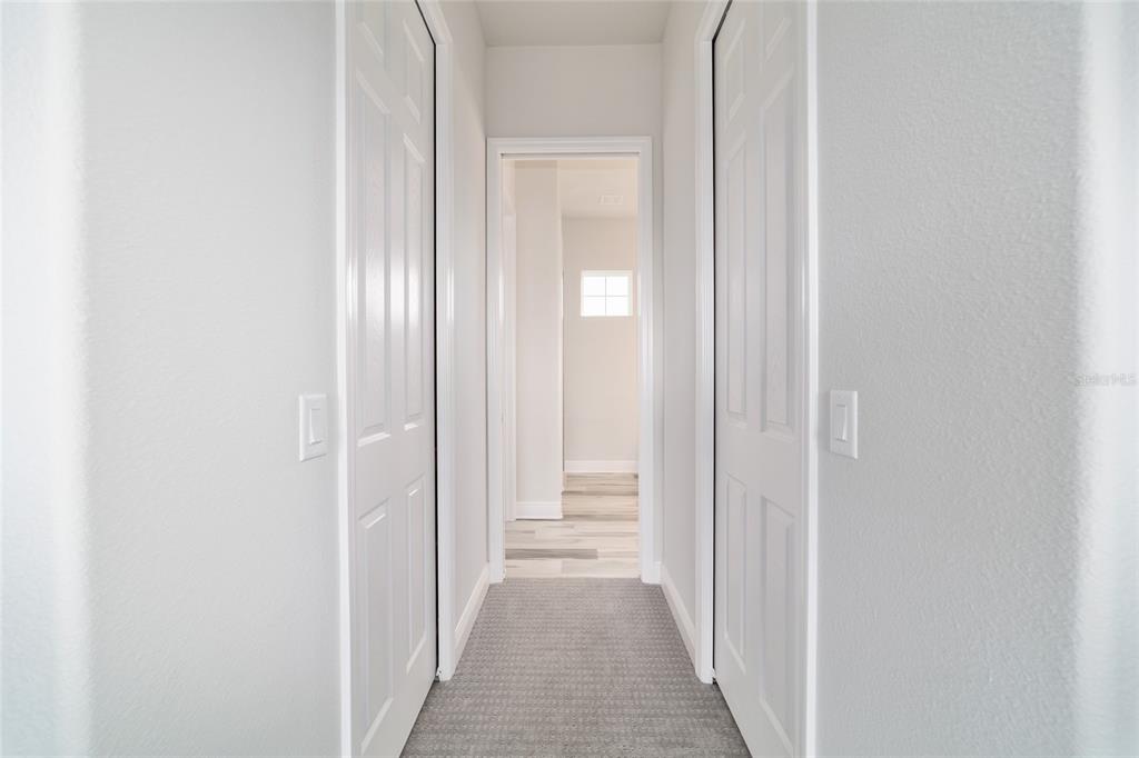 1499 East Pegasus Lane Inverness, FL 34453 - Photo 28 of 46 a view of a hallway with a wooden door