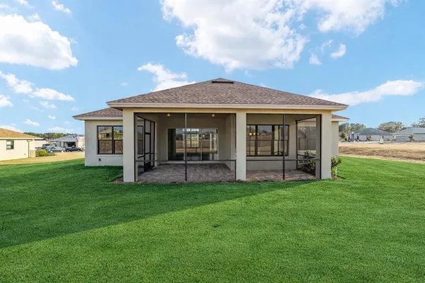 a view of house with yard and porch