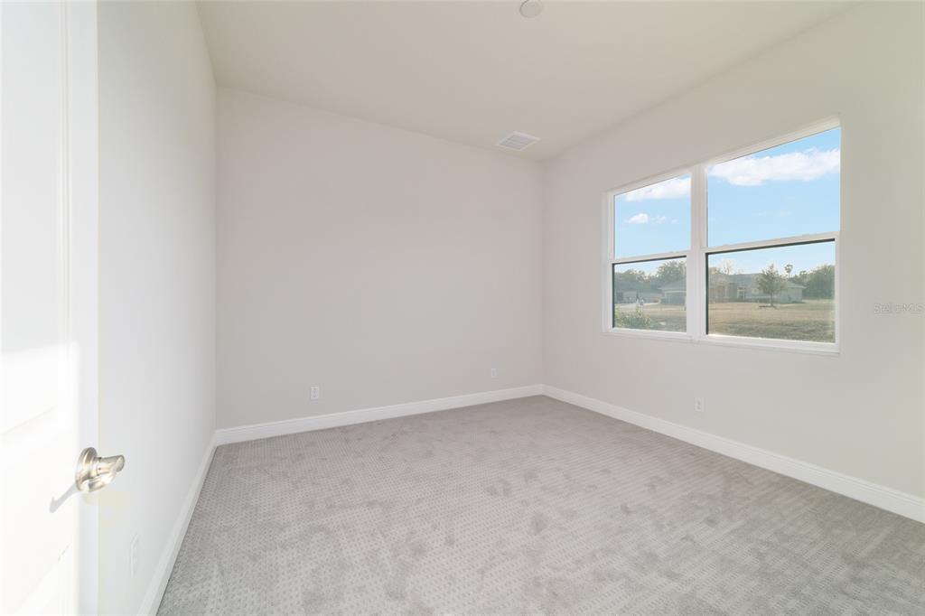 1499 East Pegasus Lane Inverness, FL 34453 - Photo 33 of 46 an empty room with a window