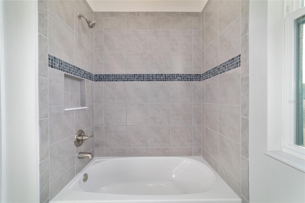 1499 East Pegasus Lane Inverness, FL 34453 - Photo 35 of 46 a bath tub sitting next to a shower