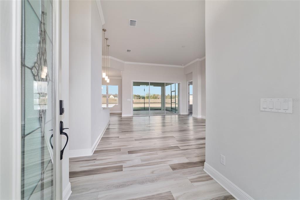 1499 East Pegasus Lane Inverness, FL 34453 - Photo 9 of 46 a view of an entryway with wooden floor