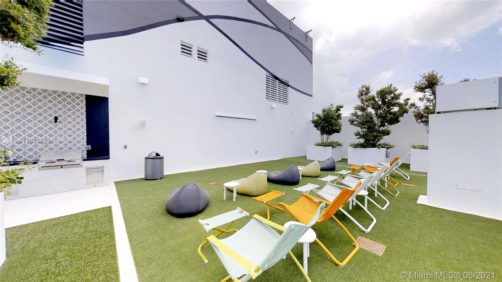 1010 Brickell Avenue, Unit 3209 Miami, FL 33131 - Photo 16 of 31 a backyard of a house with seating space