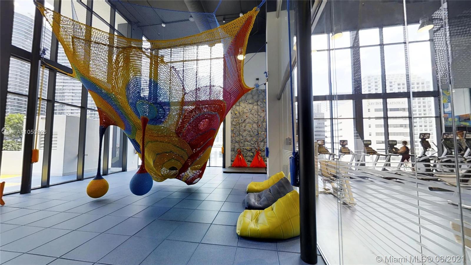 1010 Brickell Avenue, Unit 3209 Miami, FL 33131 - Photo 29 of 31 a view of living room with furniture and floor to ceiling window