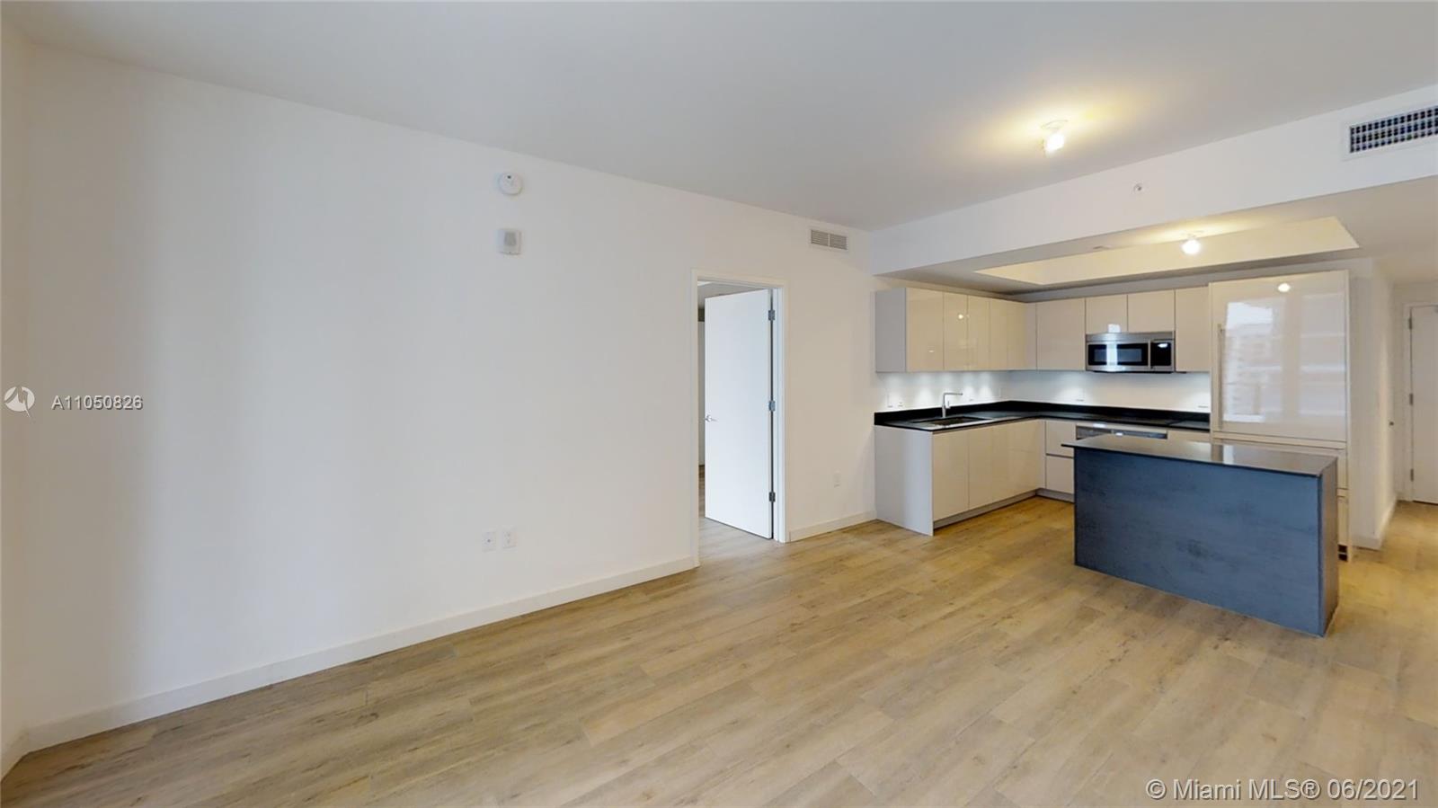 1010 Brickell Avenue, Unit 3209 Miami, FL 33131 - Photo 30 of 31 a view of kitchen with wooden floor