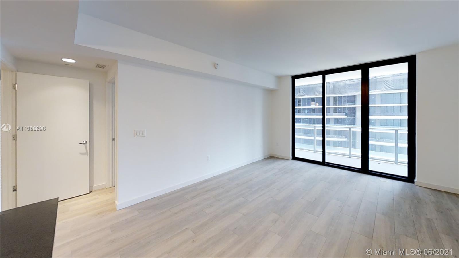 1010 Brickell Avenue, Unit 3209 Miami, FL 33131 - Photo 31 of 31 wooden floor in an empty room with a window