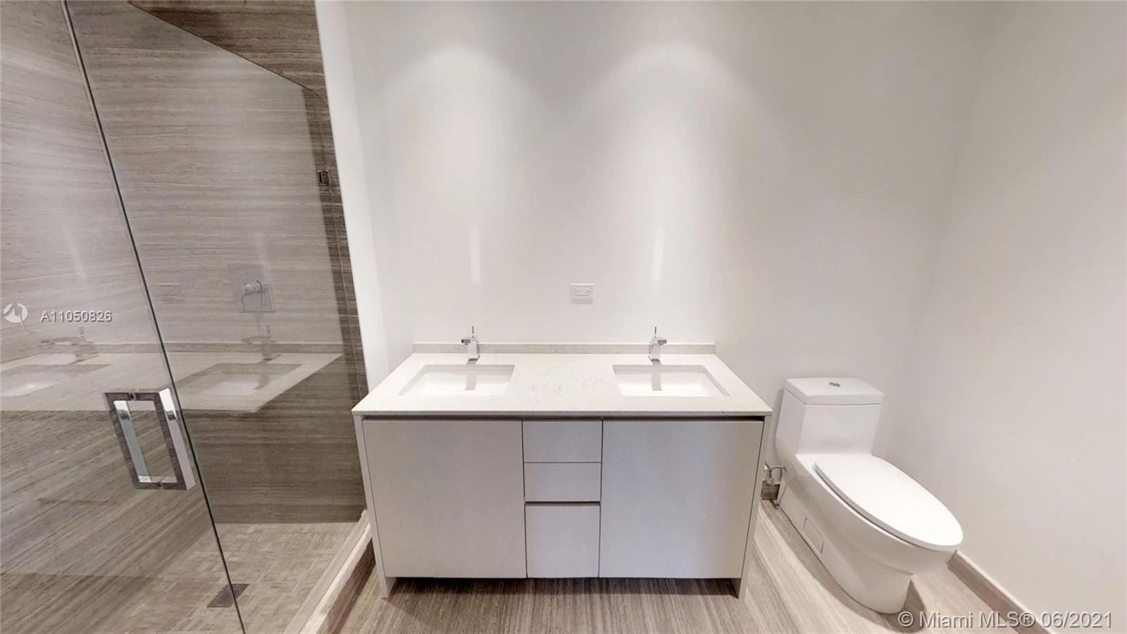 1010 Brickell Avenue, Unit 3209 Miami, FL 33131 - Photo 6 of 31 a bathroom with a sink and toilet