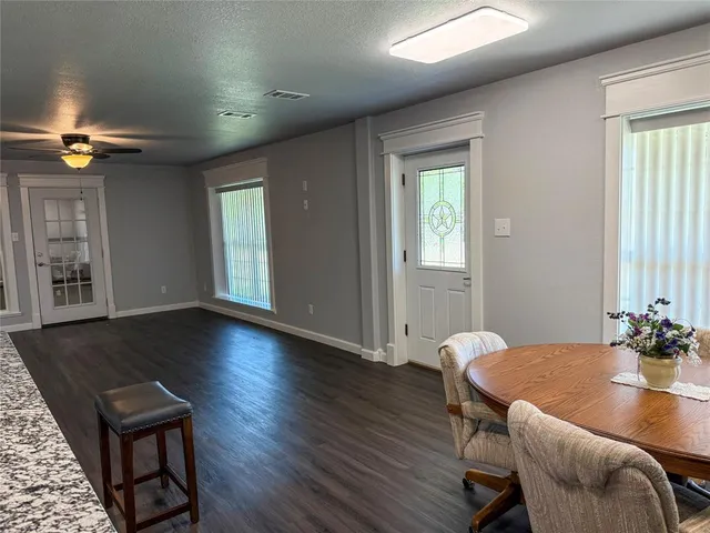 a view of a livingroom with furniture window and wooden floor