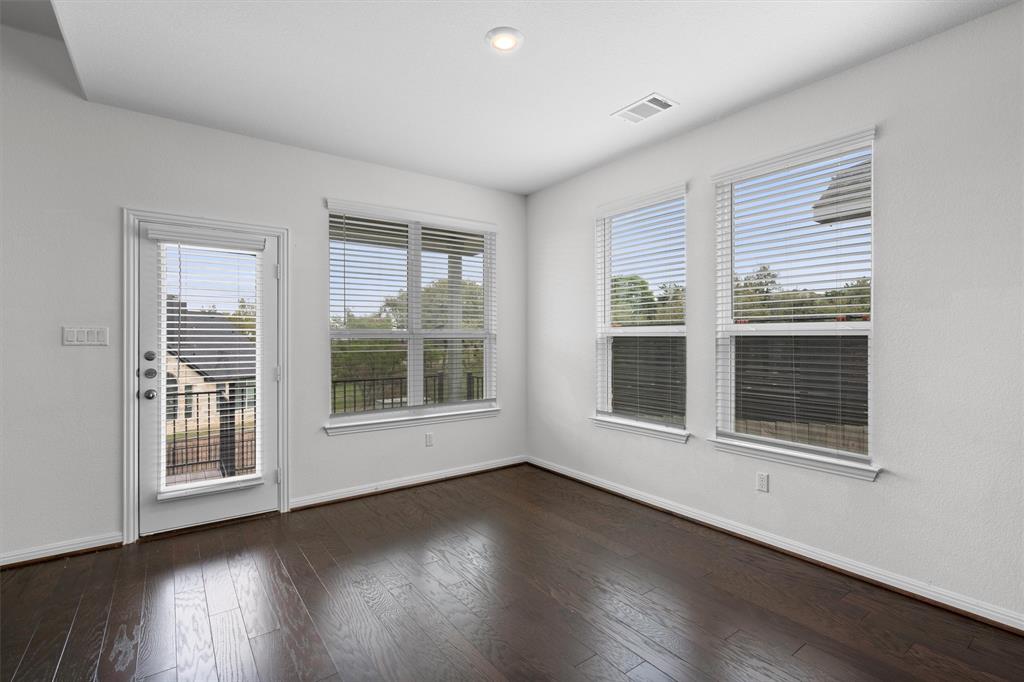 236 Prato Place Georgetown, TX 78628 - Photo 17 of 40 Rich hardwood flooring complements the naturally illuminated interior with exterior access.