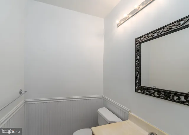 a bathroom with a window and a shower