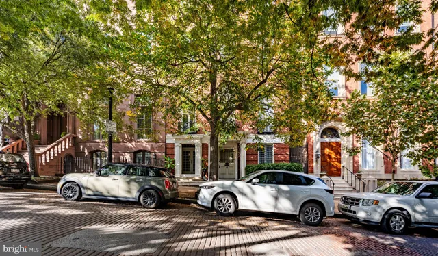 a view of car parked in front of a building