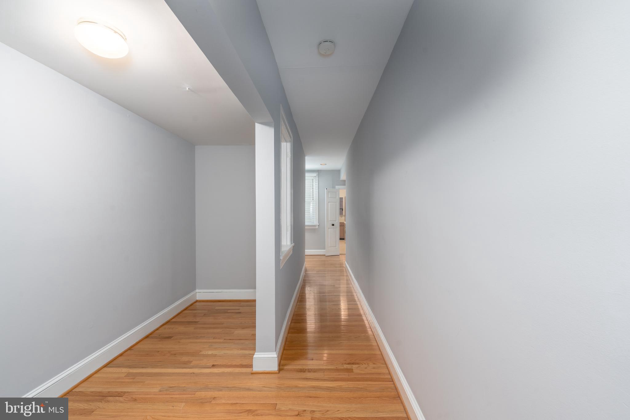 14 East Mt Vernon Place, Unit 15 Baltimore, MD 21202 - Photo 9 of 29 a view of a hallway with wooden floor