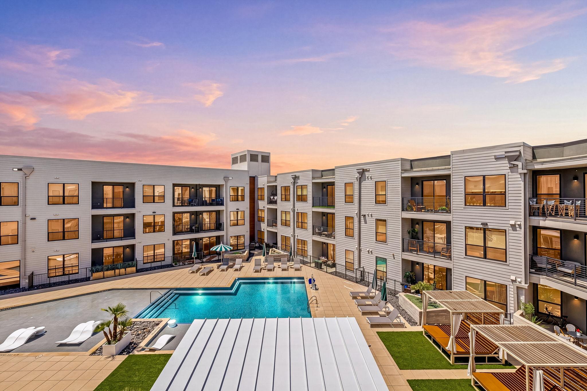 1701 Simond Avenue, Unit 612 Austin, TX 78723 - Photo 2 of 40 a front view of a building with swimming pool and porch