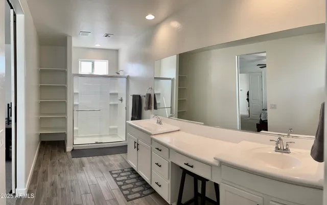 a spacious bathroom with a granite countertop sink mirror and toilet