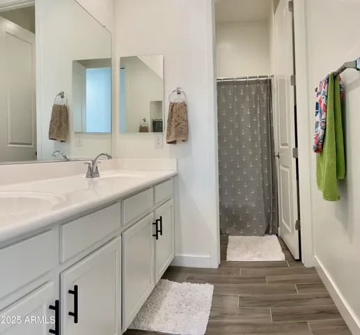 a bathroom with a sink and mirror