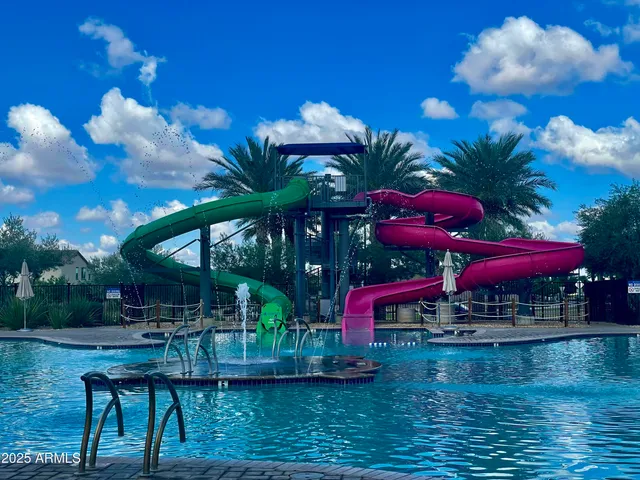 a childrens park with lots of swings and slides