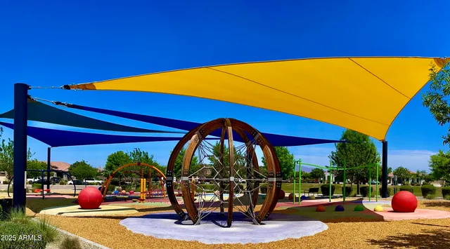 a view of a patio with chairs and a table
