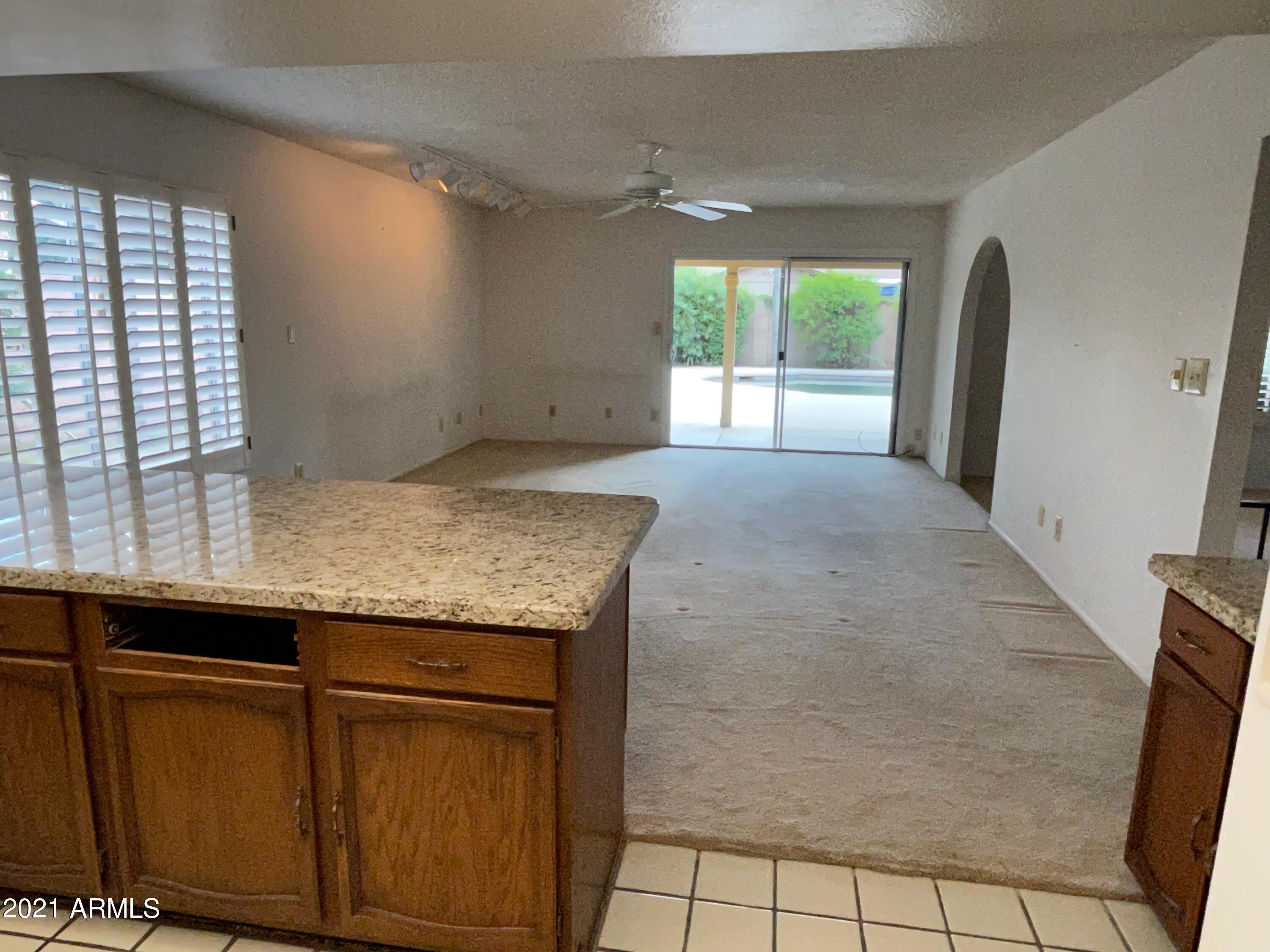 2461 West Hearn Road Phoenix, AZ 85023 - Photo 14 of 26 Kitchen to Family Room