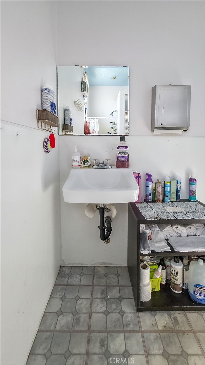 5929 Adobe Road Twentynine Palms, CA 92277 - Photo 15 of 33 a bathroom with a sink and a mirror