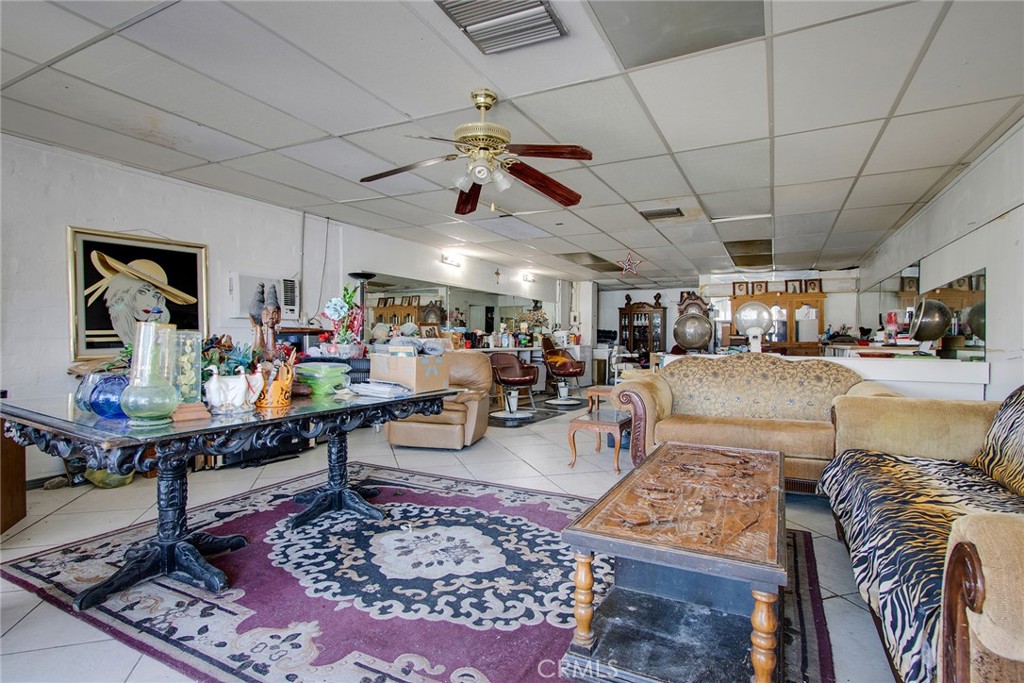 5929 Adobe Road Twentynine Palms, CA 92277 - Photo 16 of 33 a living room with lots of furniture and a rug