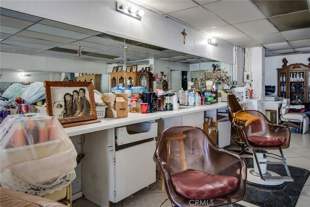 5929 Adobe Road Twentynine Palms, CA 92277 - Photo 17 of 33 a room with granite countertop a couch and chairs