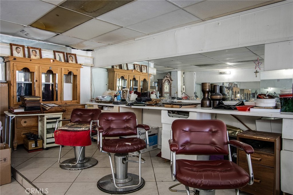 5929 Adobe Road Twentynine Palms, CA 92277 - Photo 18 of 33 a living room with furniture a piano and kitchen view