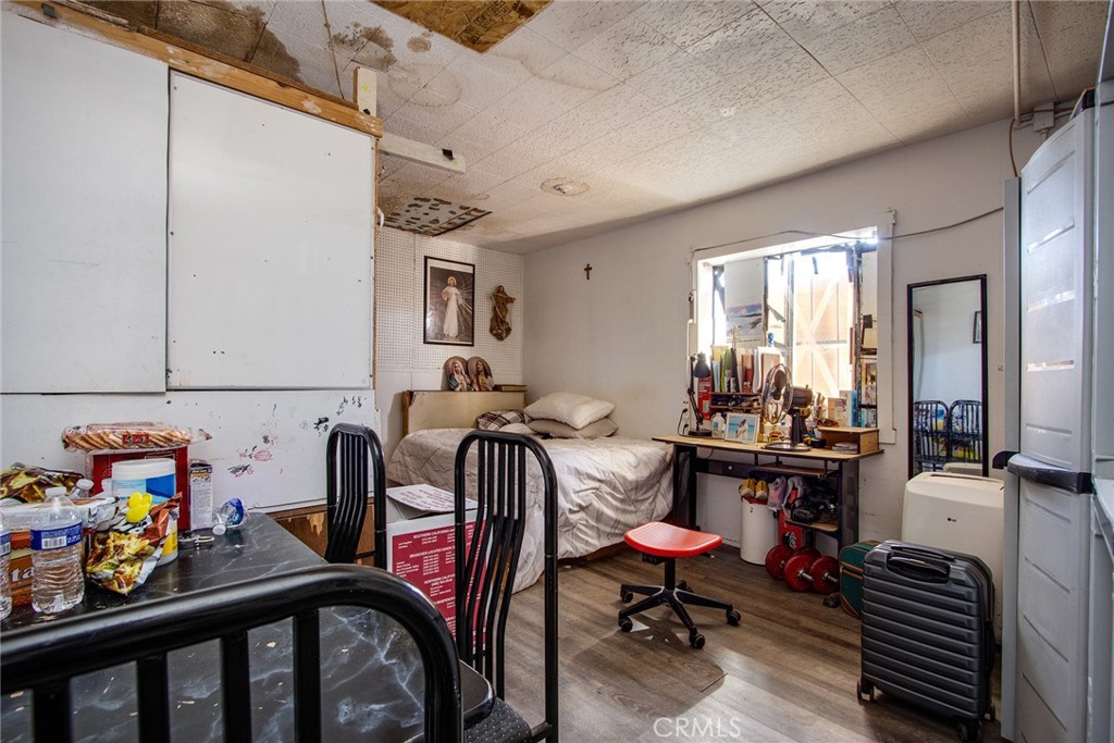 5929 Adobe Road Twentynine Palms, CA 92277 - Photo 23 of 33 a view of a dining room with furniture window and wooden floor