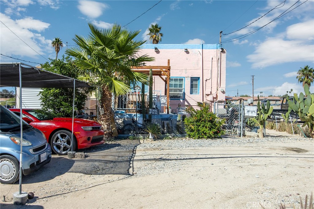 5929 Adobe Road Twentynine Palms, CA 92277 - Photo 30 of 33 a car parked in front of a house