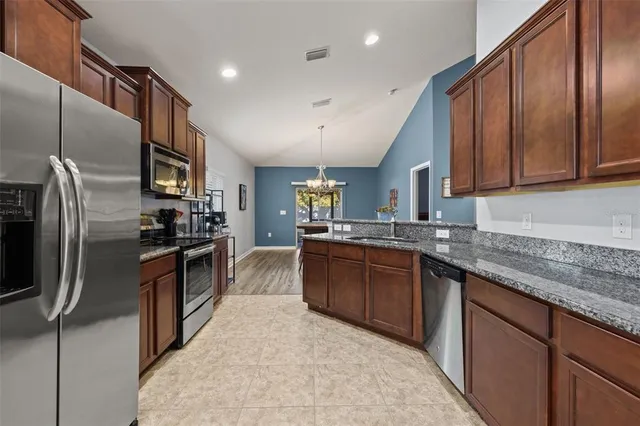 a bedroom with a bed and a ceiling fan