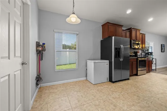 a bed room with a bed and a chandelier
