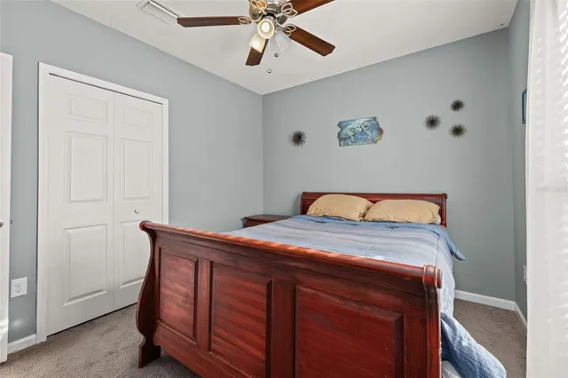 a spacious bathroom with a granite countertop tub sink and mirror