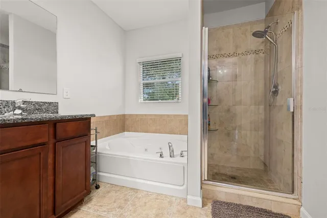 a view of a livingroom with workspace and a window