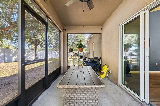 a view of a swimming pool with an outdoor space and seating area